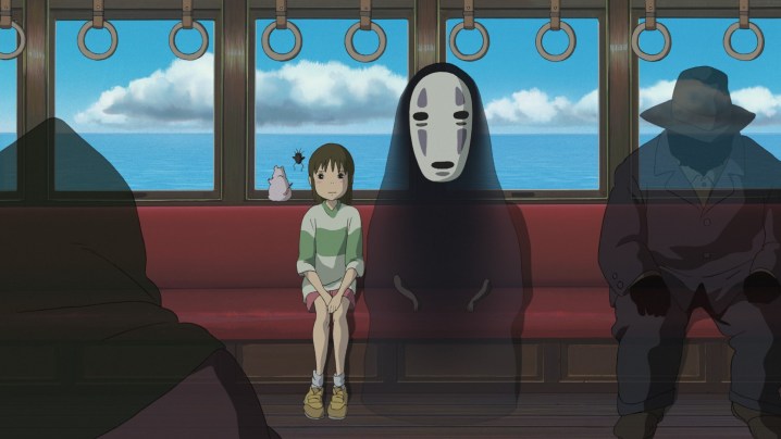 Chihiro stand cu No-Face in Spirited Away.